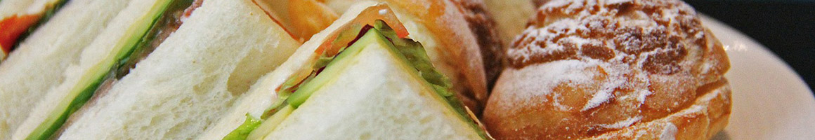 Eating Sandwich at Latte Da restaurant in Eureka, MT.